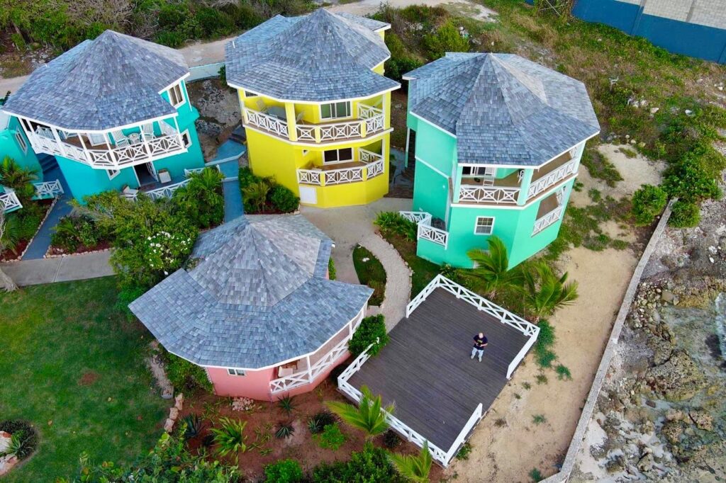 987D6ADE-6CDB-4106-9D82-7320C08EAE62 Aerial view of colorful waterfront suites at Arawak Beach Club in Anguilla