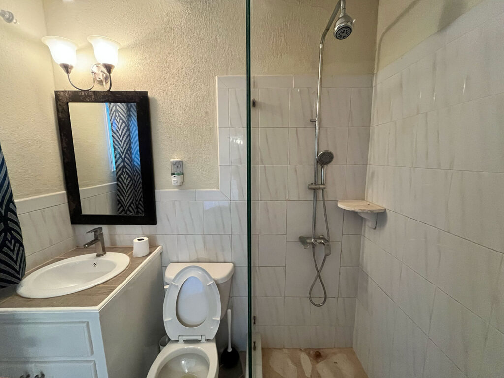 Arawak_suite-1-4_1600 Walk-in shower and vanity in Ocean Pearl suite bathroom at Arawak Beach Club, Anguilla