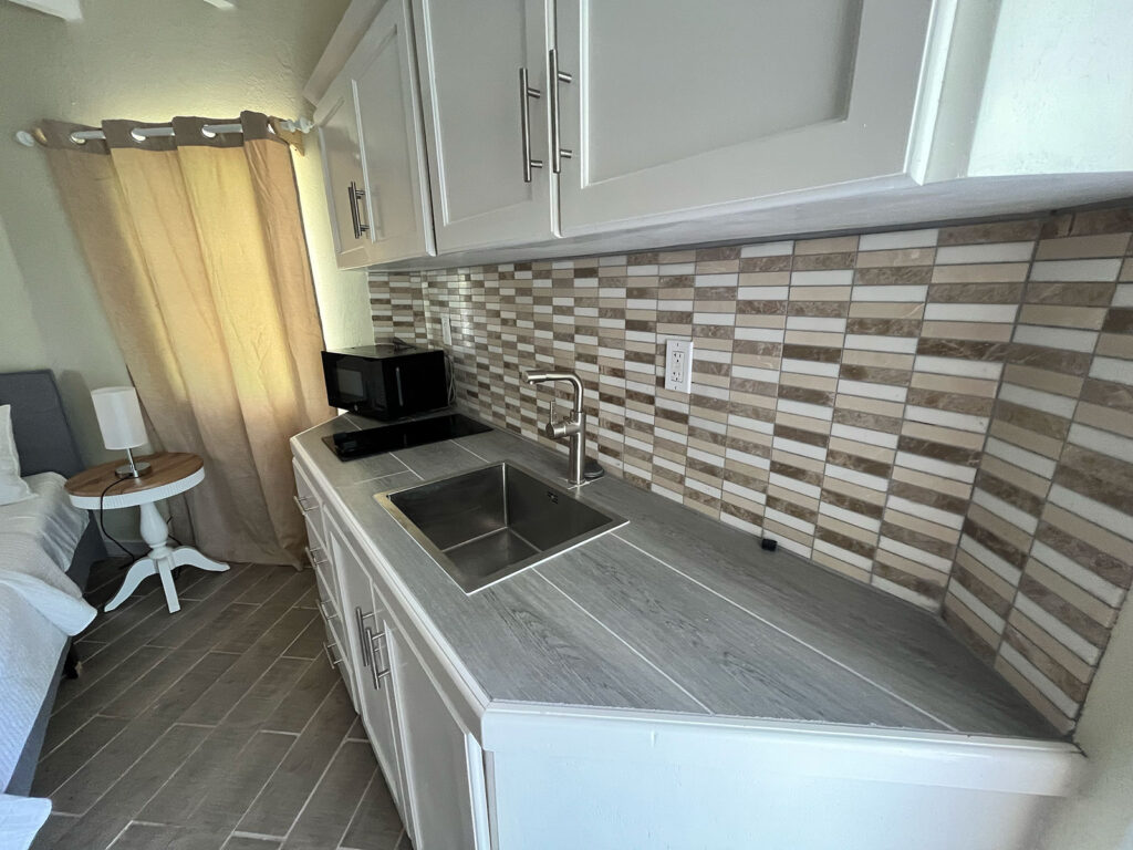 Arawak_suite-1-5_1600 Bright kitchen countertop with modern backsplash in Ocean Pearl Suite at Arawak Beach Club, Anguilla