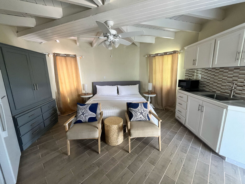 Arawak_suite-1-8_1600 Open-concept kitchen and dining area in suite at Arawak Beach Club, Anguilla