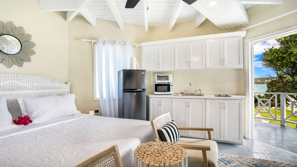 Arawak_suite-3-3_1600 Bright studio layout with bed, kitchenette, and seating area in the Parrot Fish Suite at Arawak Beach Club in Anguilla