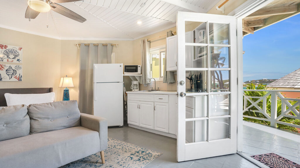 Arawak_suite-4-5_1600 Studio-style suite with kitchenette, French doors, and seating in the Blue Horizon Suite at Arawak Beach Club in Anguilla