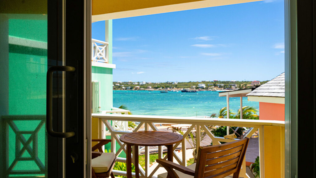 Arawak_suite-6-5_1600 Private balcony with ocean view and table in Ocean Bliss Suite at Arawak Beach Club in Anguilla