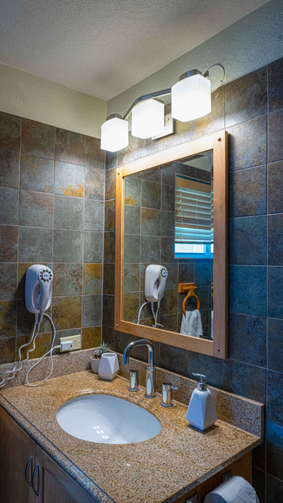 Arawak_suite-6-6_1600 Large bathroom mirror and vanity lighting in Ocean Bliss Suite at Arawak Beach Club in Anguilla