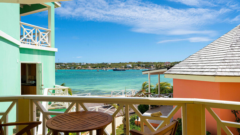 Arawak_suite-6-9_1600 Ocean view from balcony with chairs in Ocean Bliss Suite at Arawak Beach Club in Anguilla