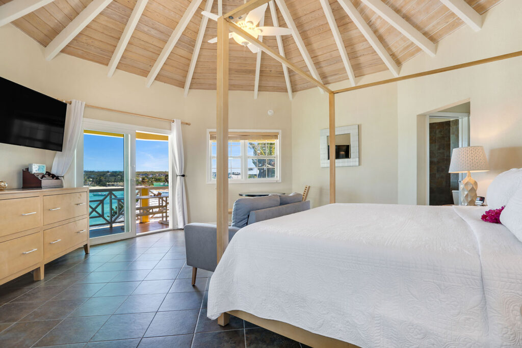 Arawak_suite-7-1_1600 Ocean view through balcony doors from the Sunset Suite at Arawak Beach Club in Anguilla