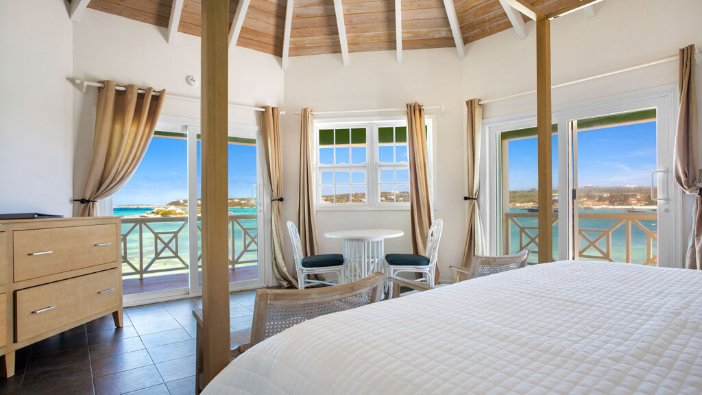 Arawak_suite-9-5_1600 Oceanfront bedroom view with king bed and vaulted ceiling in the Sea View Suite at Arawak Beach Club in Anguilla