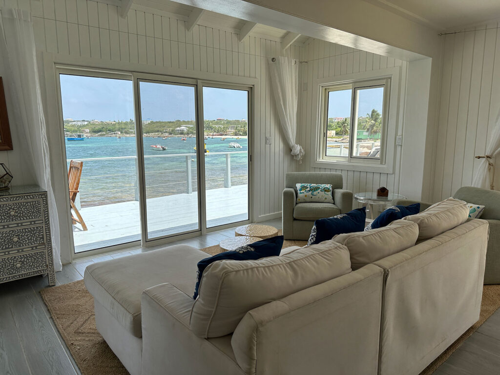 Arawak_villa-12_1600 Wraparound windows and ocean views from the living room at Arawak Villa