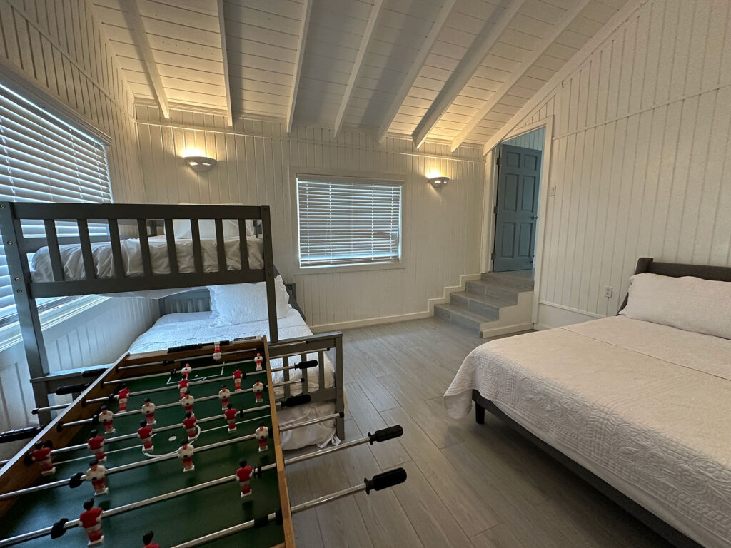 Arawak_villa-17_1600 Guest bedroom with foosball table and bunk beds at Arawak Villa, Anguilla villa rental