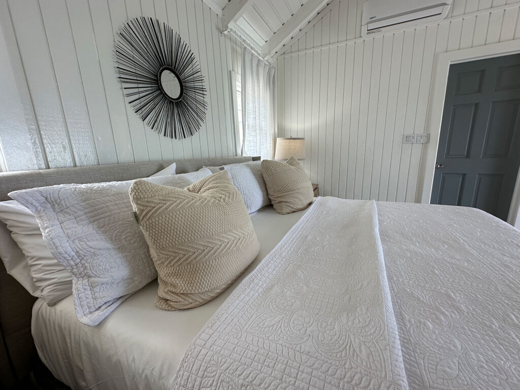 Arawak_villa-23_1600 bedroom with neutral tones and vaulted ceiling at Arawak Villa