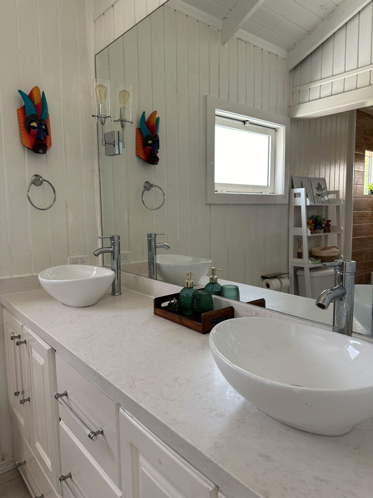Arawak_villa-32_1600 Guest bathroom with double sinks inside Arawak Villa