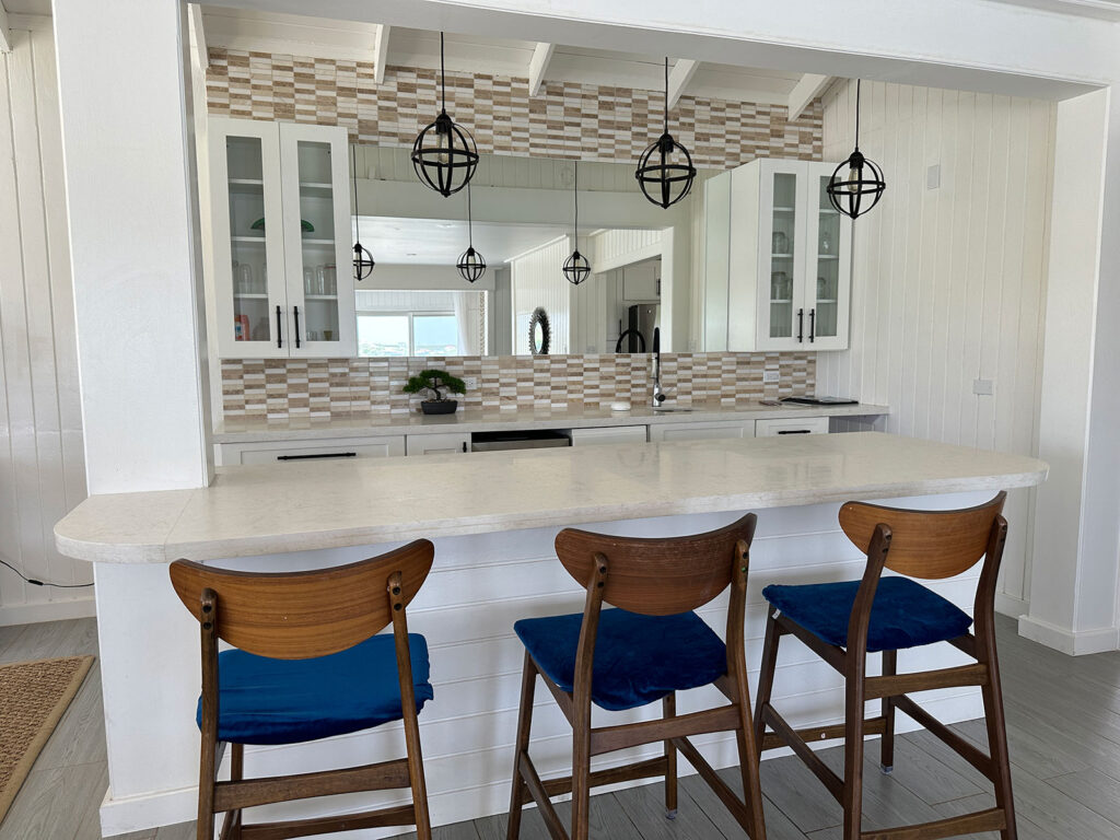 Arawak_villa-7_1600 Bar seating and kitchen island inside Arawak Villa